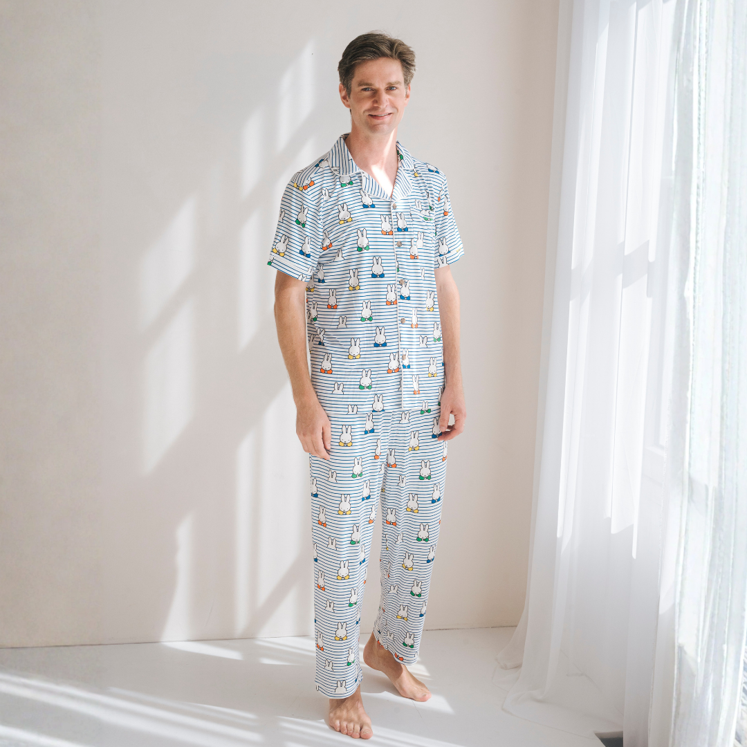 Man wearing the Men's Miffy Peek-a-Boo Blue bamboo pyjama set